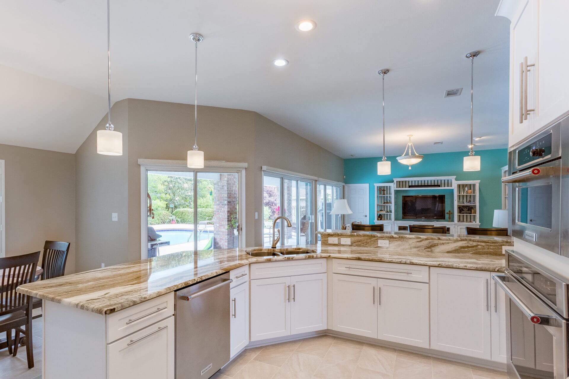 Open floor plan kitchen and living room with Shaker cabinets